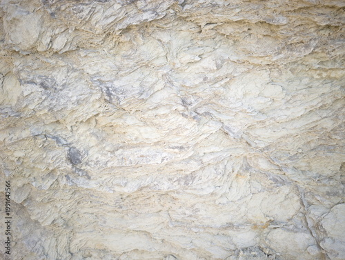 Φωτογραφία Texture di roccia sedimentaria stratificata con livelli irregolari, tonalità mar