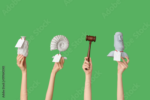 Women with auction gavel an...