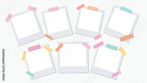 Set of blank instant photo frames pinned to a wall with colorful washi tape for a creative scrapbook or memory board.