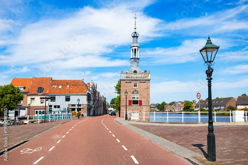 View of Accijnstoren tower and canal in Alkmaar town