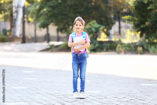 Little schoolgirl with back...