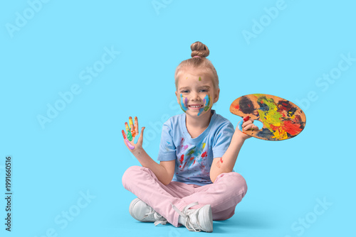 Cute little girl in paint w...