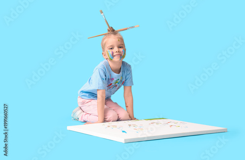 Cute little girl in paint w...