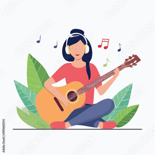 Woman playing guitar and listening to music with headphones