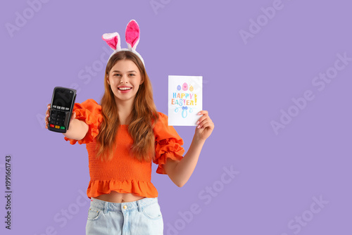 Young woman in bunny ears w...