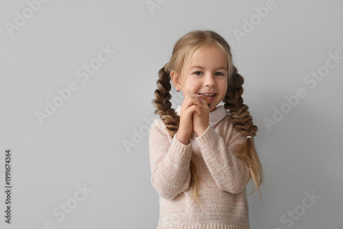 Happy little girl with cook...