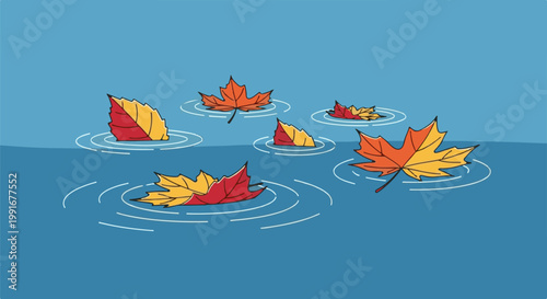 Brightly colored autumn leaves gently float and create ripples on a calm, blue watery surface