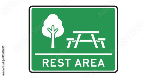 Green Rest Area Sign Indicating Picnic Table and Tree.