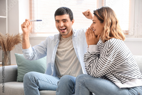 Happy young couple with pre...
