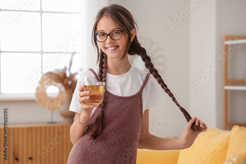 Little girl with glass of j...