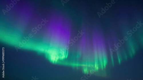 Mesmerizing Display of Aurora Borealis in Vibrant Greens and Purples Lighting up the Night Sky
