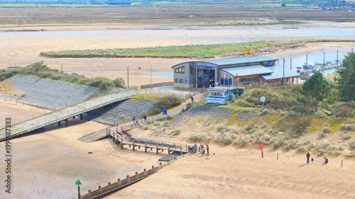 Wells Next to the Sea Beach. Sand dunes where Norfolk Coast path with beach huts and tourist beaches. Beach huts on the promenade at Gorleston-on-sea in Norfolk, UK