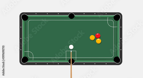 Overhead view of a green pool table with balls and cue stick.