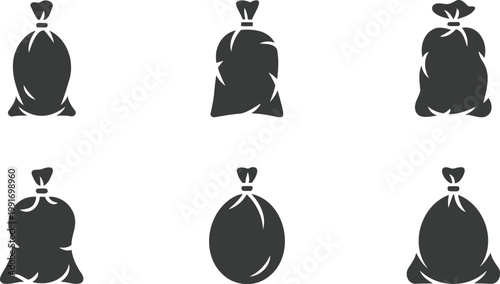 Six gray trash bags in various shapes and sizes on white background