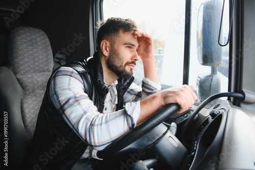 Billede på lærred Truck driver feeling stressed and tired during long journey