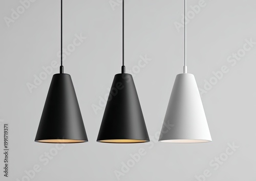 Three cone-shaped pendant lamps, two black, one white, hang against a plain wall