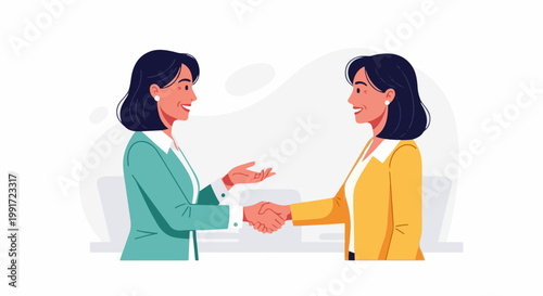 Two smiling businesswomen shake hands in a professional meeting