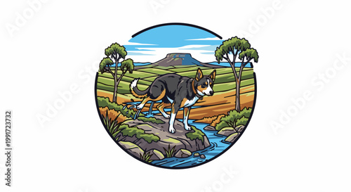 Tri-color dog on rocks by stream in rural landscape with mesa