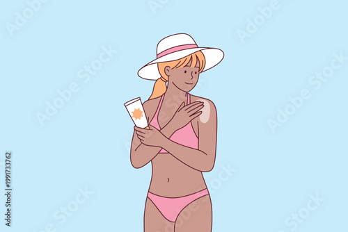 Woman with tan skin putting sunscreen on shoulder during sunny day. Concept of skin protection from UV rays and prevention of sunburn during summer.