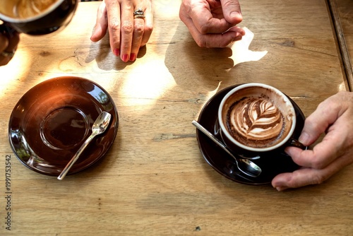 Tableau sur toile Coffee meeting with latte art.