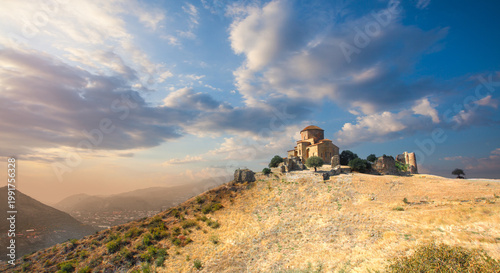 Aerial view of Jvari clifftop orthodox monastery in Mtskheta Georgia. Summer sunny day. Travel and vacation concept. Wide panorama. The place where two rivers meet Mtkvari