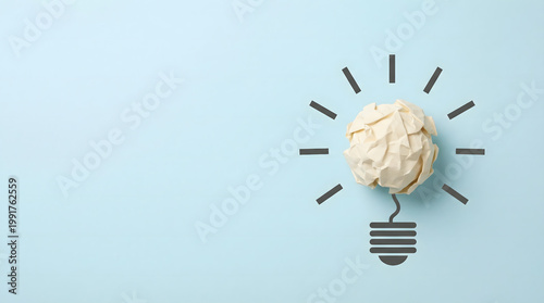 Crumpled Paper Ball as Light Bulb Symbolizing Idea Generation on Blue Background