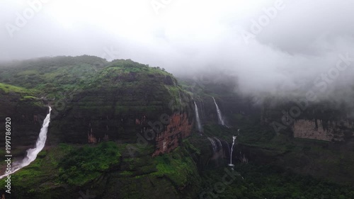 Moving Drone shot of a Huge explosive waterfall shot during heavy monsoon. Three tier waterfall. Tallest waterfall in India. Drone clip 4K60