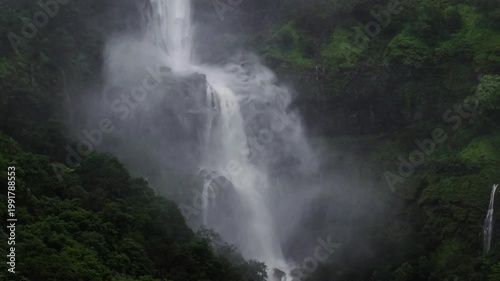 Moving Drone shot of a Huge explosive waterfall shot during heavy monsoon. Three tier waterfall. Tallest waterfall in India. Drone clip 4K60