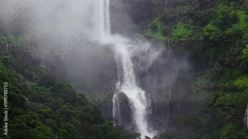 Moving Drone shot of a Huge explosive waterfall shot during heavy monsoon. Three tier waterfall. Tallest waterfall in India. Drone clip 4K60