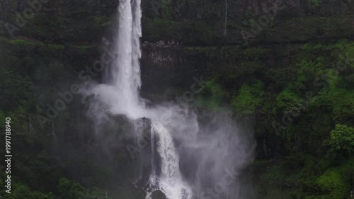 Moving Drone shot of a Huge explosive waterfall shot during heavy monsoon. Three tier waterfall. Tallest waterfall in India. Drone clip 4K60