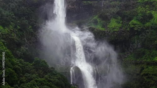 Moving Drone shot of a Huge explosive waterfall shot during heavy monsoon. Three tier waterfall. Tallest waterfall in India. Drone clip 4K60