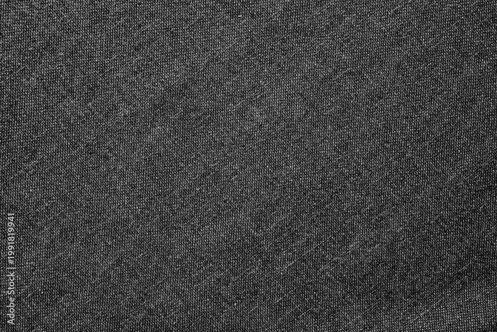 Fototapeta premium Dark gray fabric background with a textured, woven style. The background is gray, adding a subtle, sophisticated look. Simple dark gray textured background with copy space.