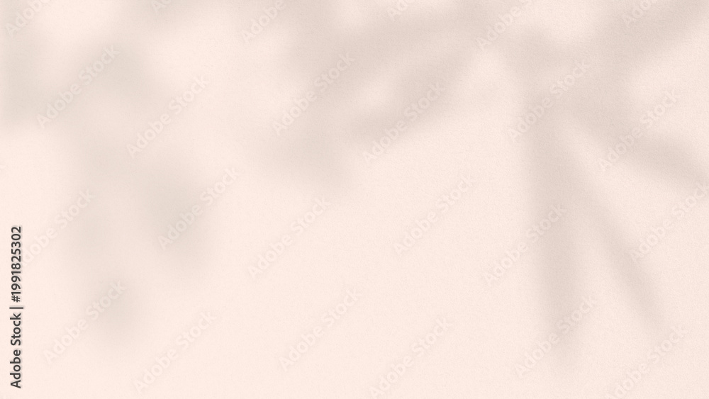 Obraz premium Beige background with a soft, blurred texture. The background features beige shadows of leaves, creating a calm, natural ambiance. Pink textured desktop wallpaper with copy space.
