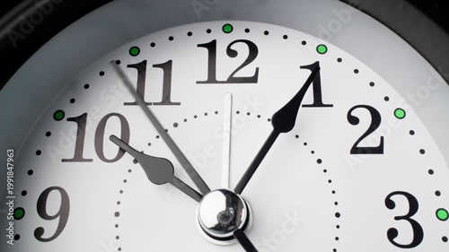 Old fashioned alarm clock with bells. Vintage clock time flowing. Clock face on white background. Time concept. Table clock show running time. Close-up in 4K, UHD