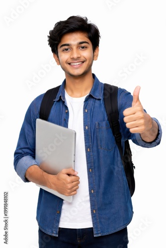 A confident young college student holding a laptop gives a thumbs up, symbolizing success, positivity, and readiness