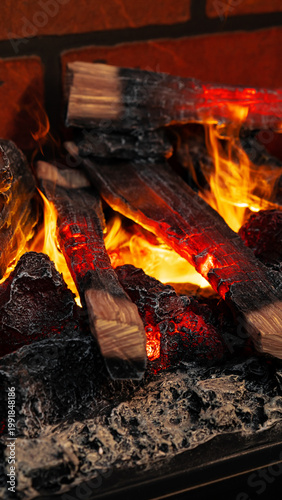 Фотография Fire burns brightly with glowing embers and logs at a cozy gathering in the even