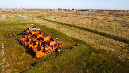 Abandoned Soviet Combine Harvesters in a Rural Field