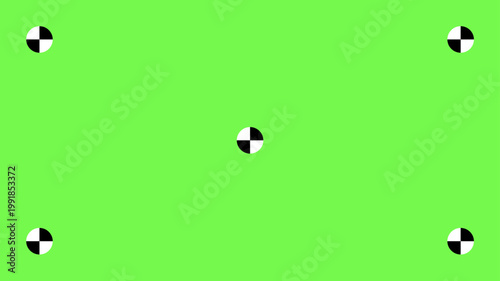 Professional greenscreen setup with tracking points and motion markers for seamless chroma key compositing in cinema and television post-production