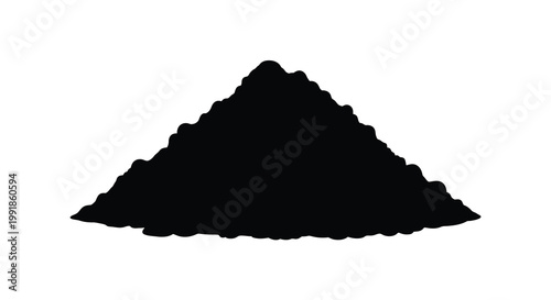 A stark silhouette of a conical pile of dark granular material