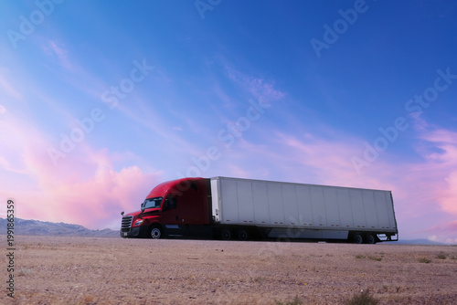 truck driving on highway through nature and mountains. Commercial vehicle transport for logistics and shipping.