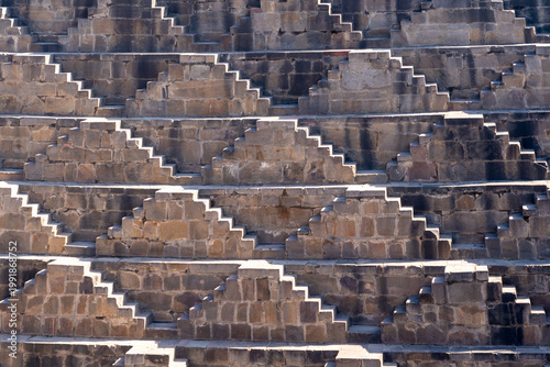 The narrow steps at Chand Baori stepwell, a historic water reservoir located in the village of Abhaneri in Rajasthan, India. 