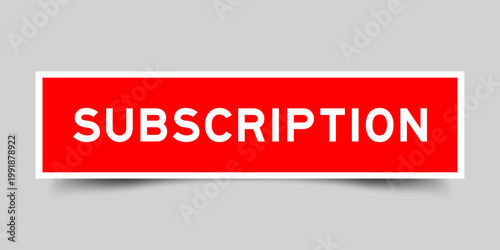 Red color square shape sticker label with word subscription on gray background
