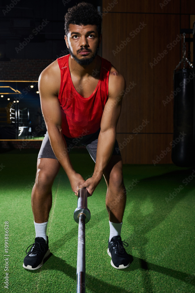 Fototapeta premium Dynamic workout session of a young African American man at the gym