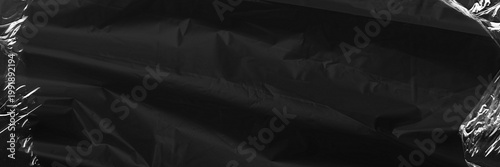 Tableau sur toile Black fabric texture background, plastic wrap border
