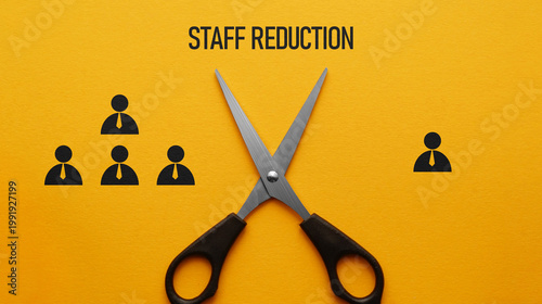 Fotografie Staff reduction concept with scissors cutting workforce icons, downsizing layoff