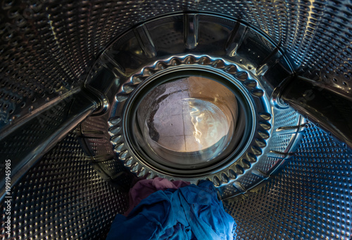 Inside View of Washing Machine Drum with Colorful Laundry