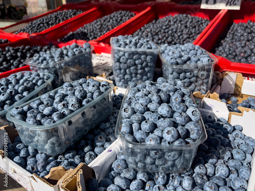 Local seasonal freshness and clean eating concept with fresh blueberries packed in containers at Riga Central Market, highlighting natural ingredients, antioxidant value, and conscious food choices