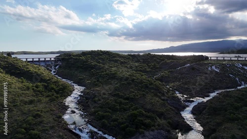 Panoramic aerial view of a large dam and water reservoir in San Luis, Argentina.