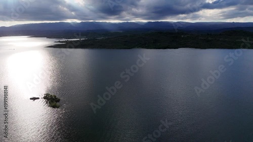 Panoramic aerial view of a large dam and water reservoir in San Luis, Argentina.