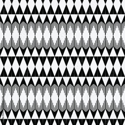 Modern monochromatic seamless pattern featuring repeating tribal triangles and diamond shapes with textured hatching. Ideal for textile and decor.
